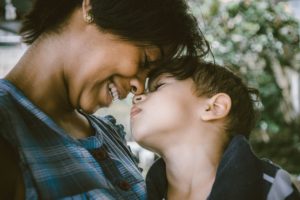 Image of a woman smiling as she and her child touch their faces together. Photo by Bruno Nascimento on Unsplash Image of a woman smiling as she and her child touch their faces together. Photo by Bruno Nascimento on Unsplash