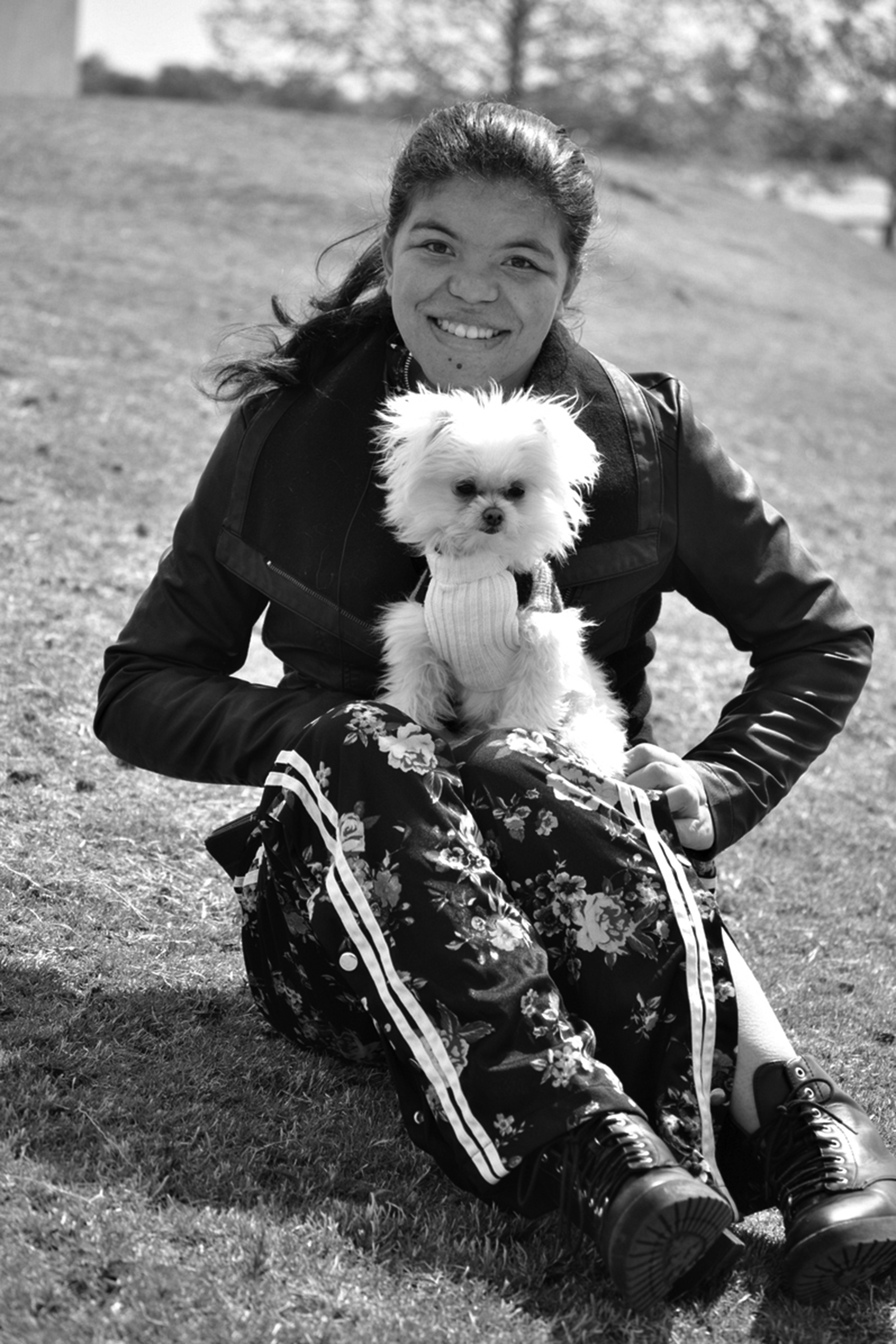 young woman sits with her sevice dog