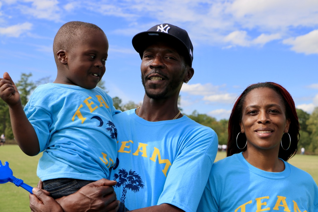 a family enjoys buddy walk 2017 at Saluda Sholes Park