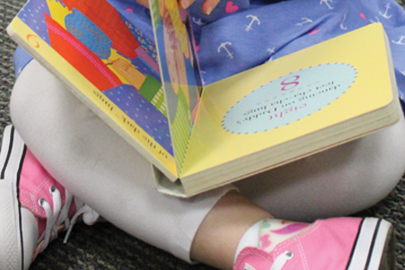 child reads a beginners book