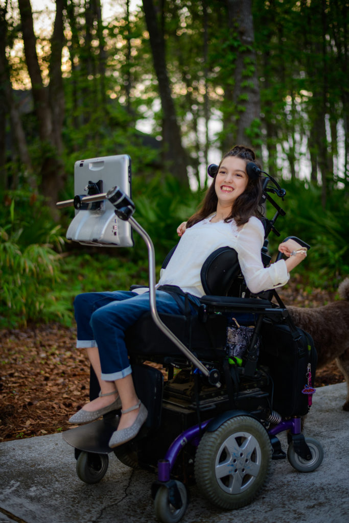 girl in wheelchair outside