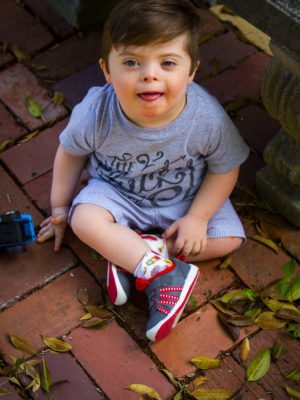 boy sitting on ground