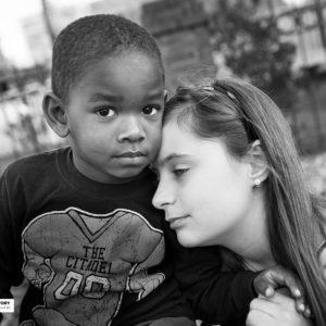 little boy and girl touching faces