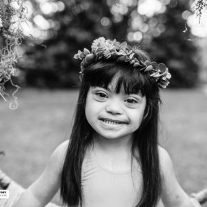 girl in flower crown smiling