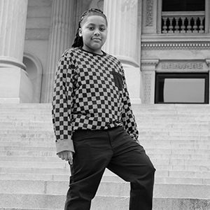 Alexander stands on the state house steps