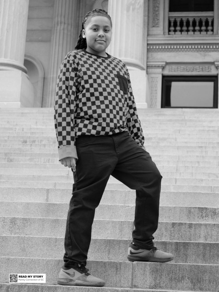 Alexander stands on the state house steps