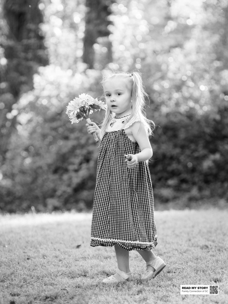 girl holding bouquet outside