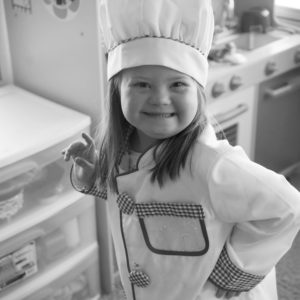 Catherine cooks in her toy kitchen