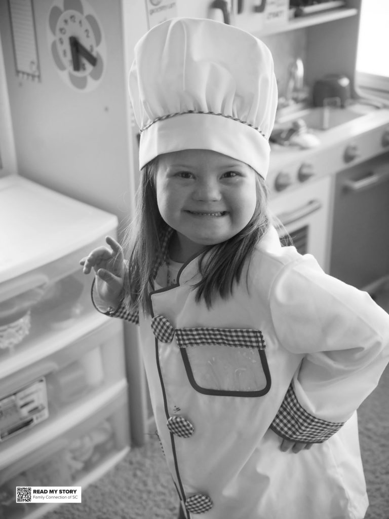 Catherine cooks in her toy kitchen
