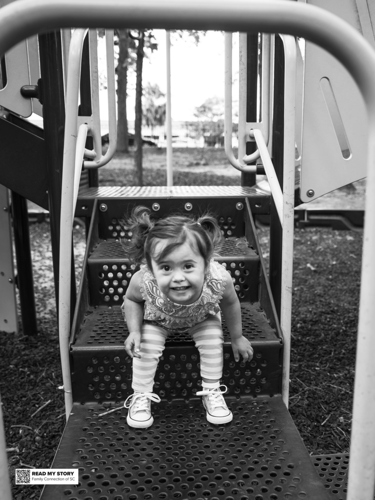 young girl plays on a playground