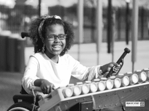 Girl plays xylophone in a park 