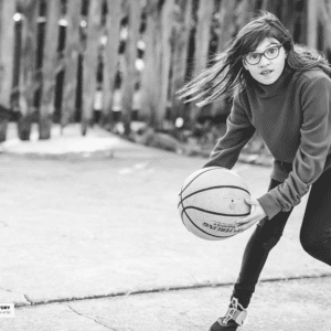 Girl plays basketball