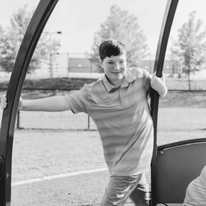 boy runs with a mary-go-round