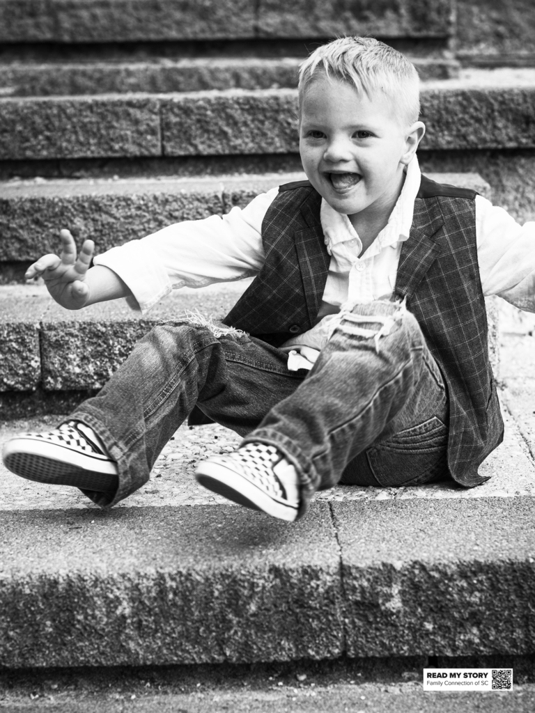 boy sits on some steps