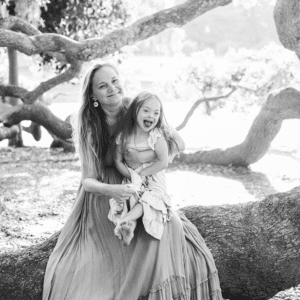 girl sits with her mother