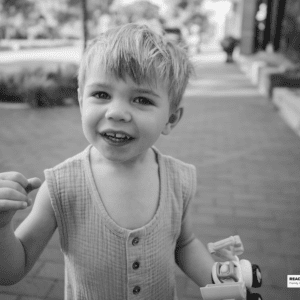 boy holds his toy truck