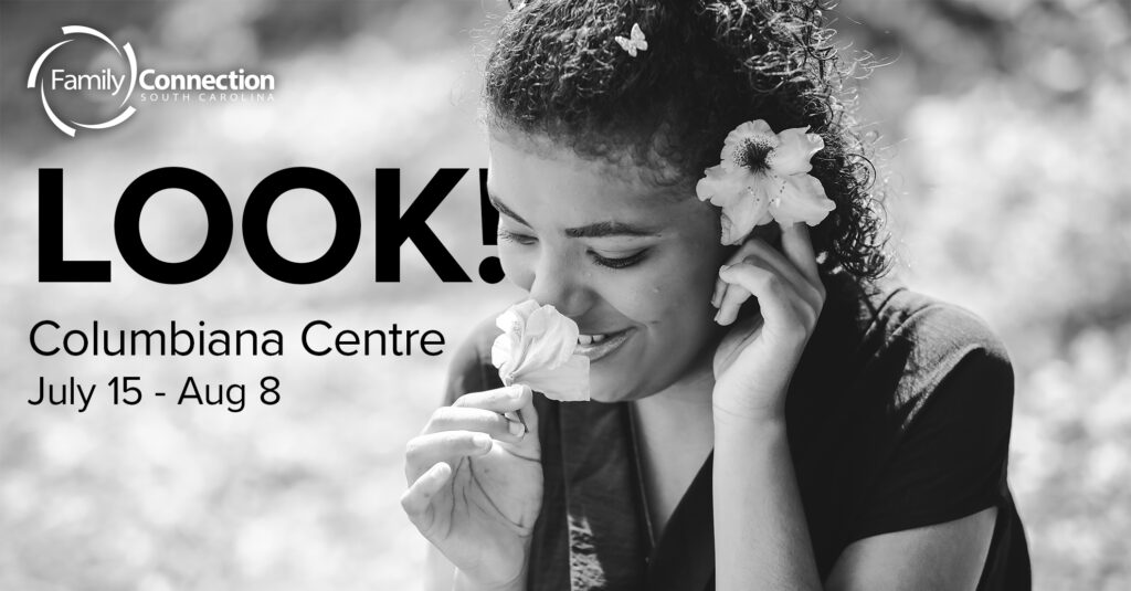 "LOOK!" Columbia Centre July 15 - Aug 8: young woman smells a flower