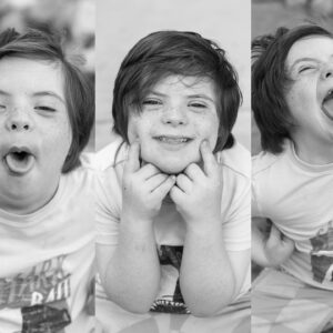 boy smiles and makes