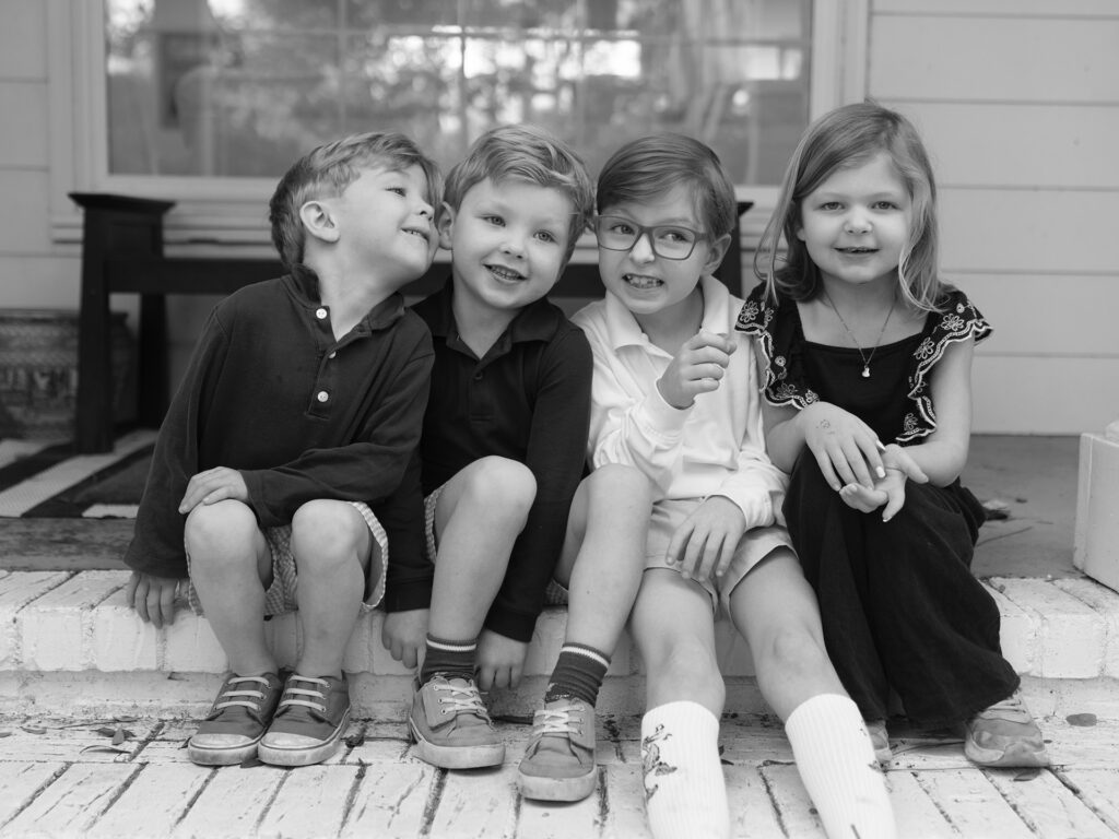 four siblings sit on the st
