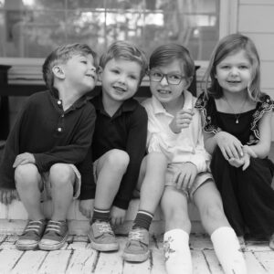 four siblings sit on the st