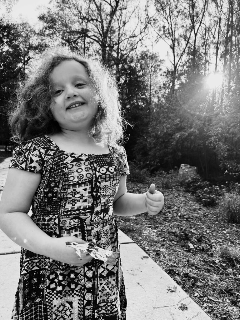 girl smiles in the sunset