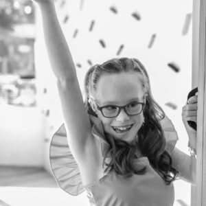 girl smiles striking a pose