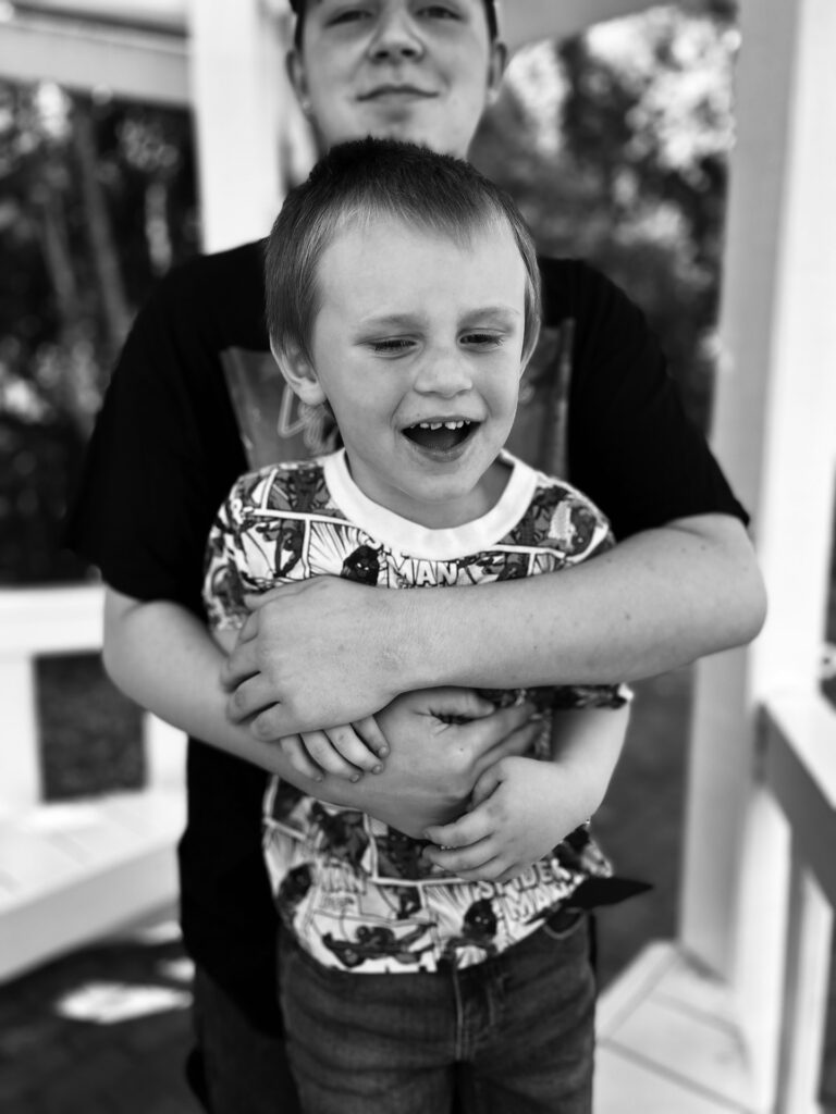 two brothers hug
