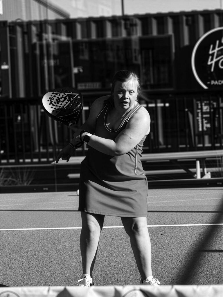 young woman playing pickle ball