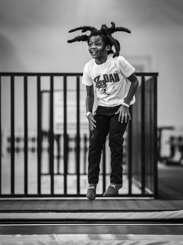 boy jumps on trampoline