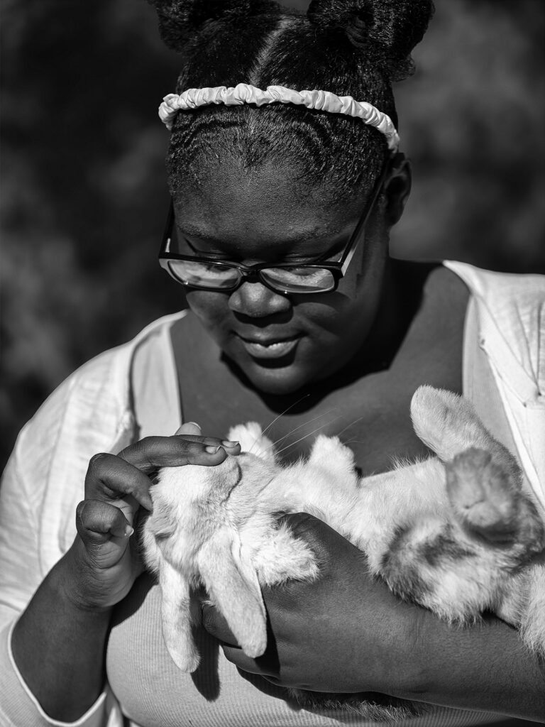 young woman with pet rabbit