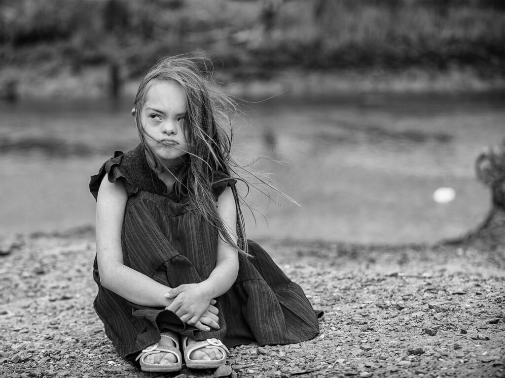 girl with windblown hair in her face