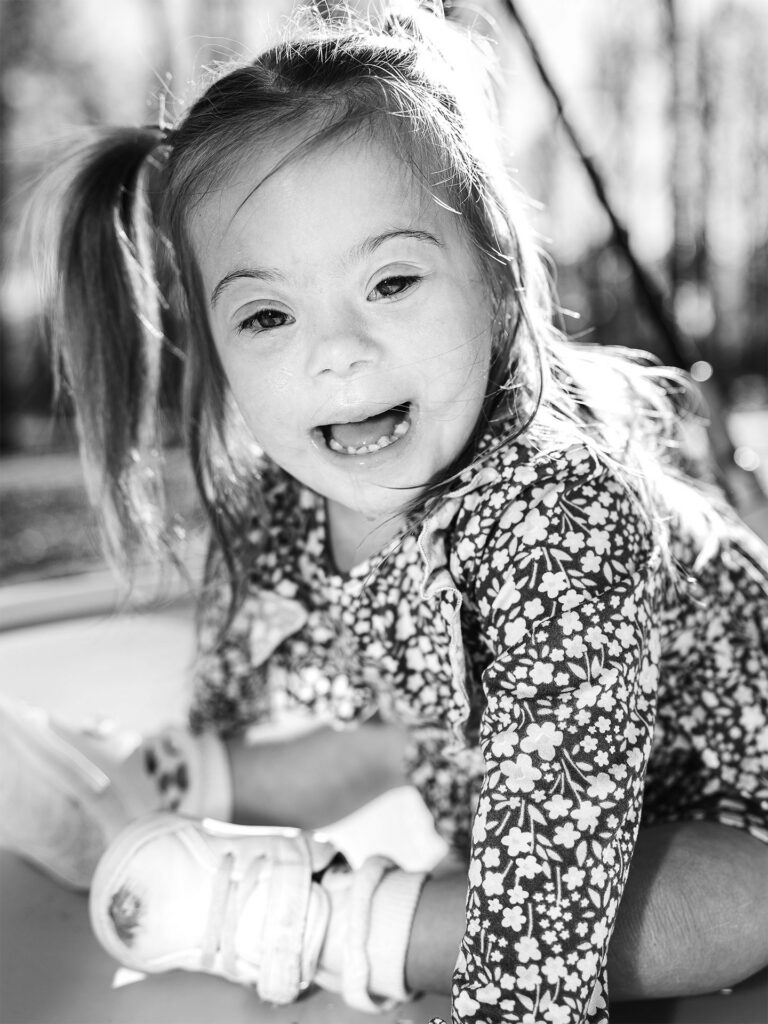 young girl laughs